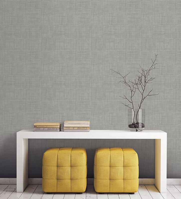 Grey Architectural texture in a vignette with yellow ottomans and white table